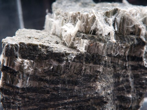 Block of dark coloured asbestos
